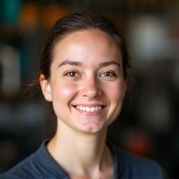 Headshot of Chloé Gagnon, lead bike mechanic, with tools in the background.
